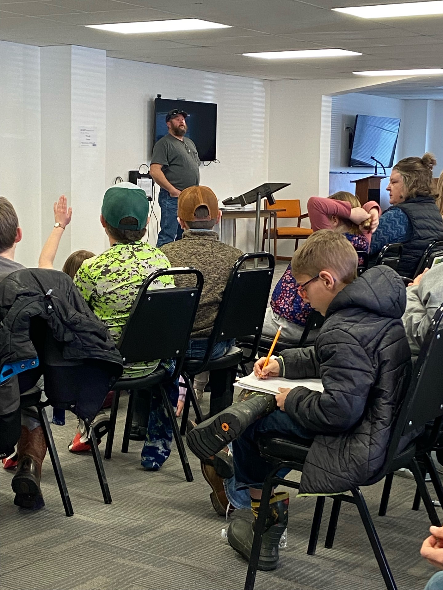 4-H members taking notes and asking questions at our Swine Health Workshop.
